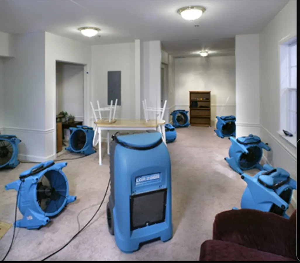 Air movers and dehumidifier setup for Water Damage Restoration in Edgemere