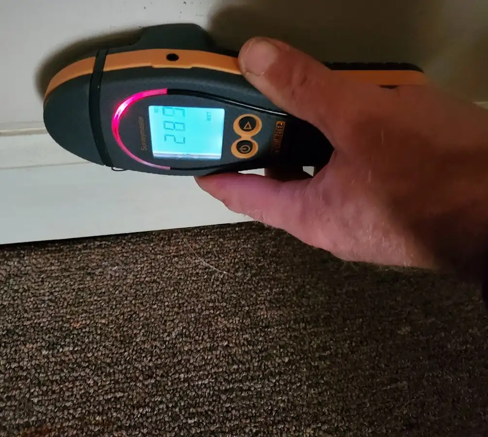 Moisture detection at baseboard during Storm Damage Restoration in Edgemere
